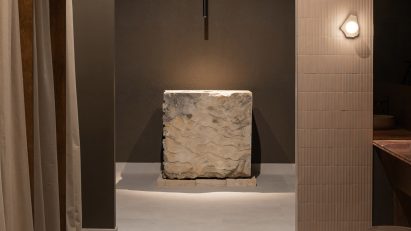Spa interior with large stone sink and stone offcut sconce lights