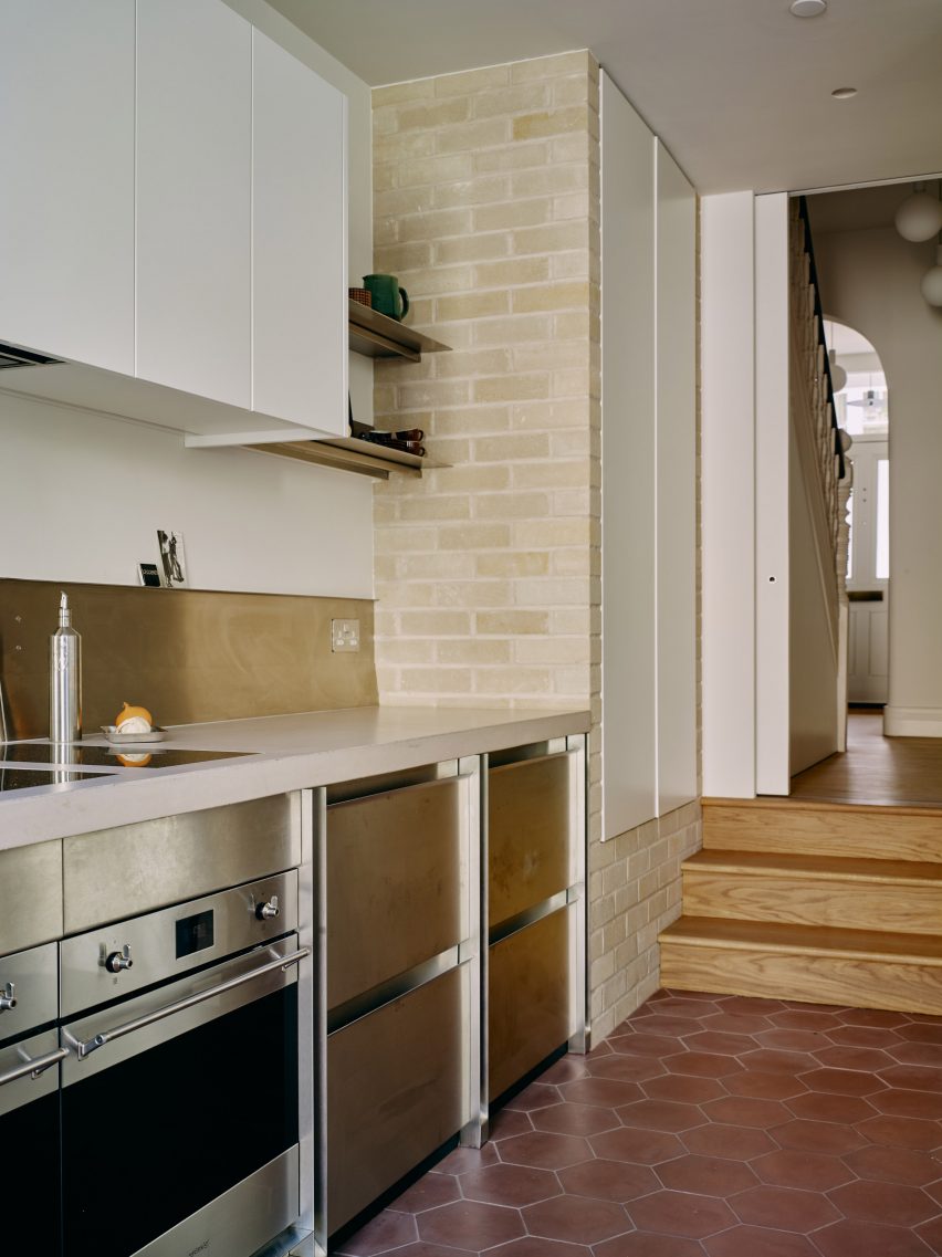 Steel kitchen cabinets in Stone and Steel House extension by DGN Studio and Sarah Izod
