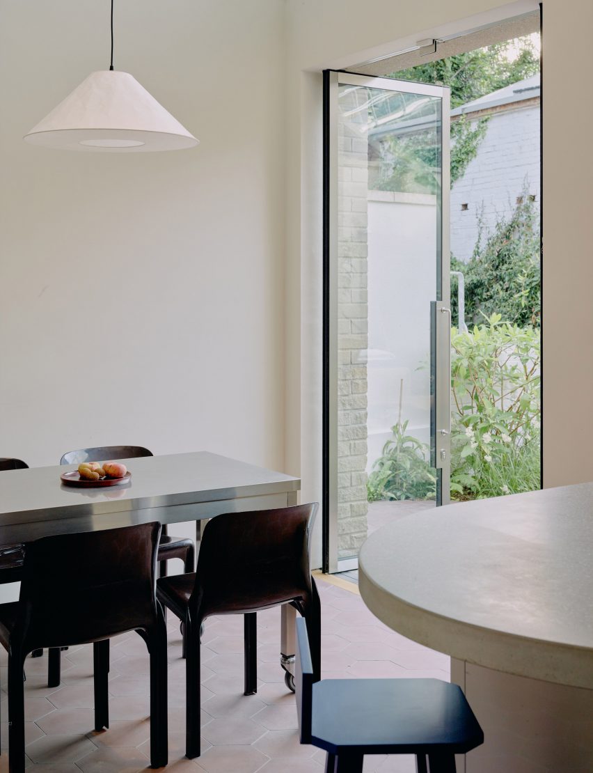 Table in Stone and Steel House extension by DGN Studio and Sarah Izod