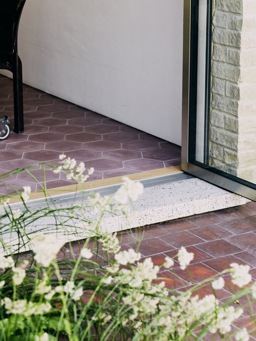 Door step in Stone and Steel House extension by DGN Studio and Sarah Izod