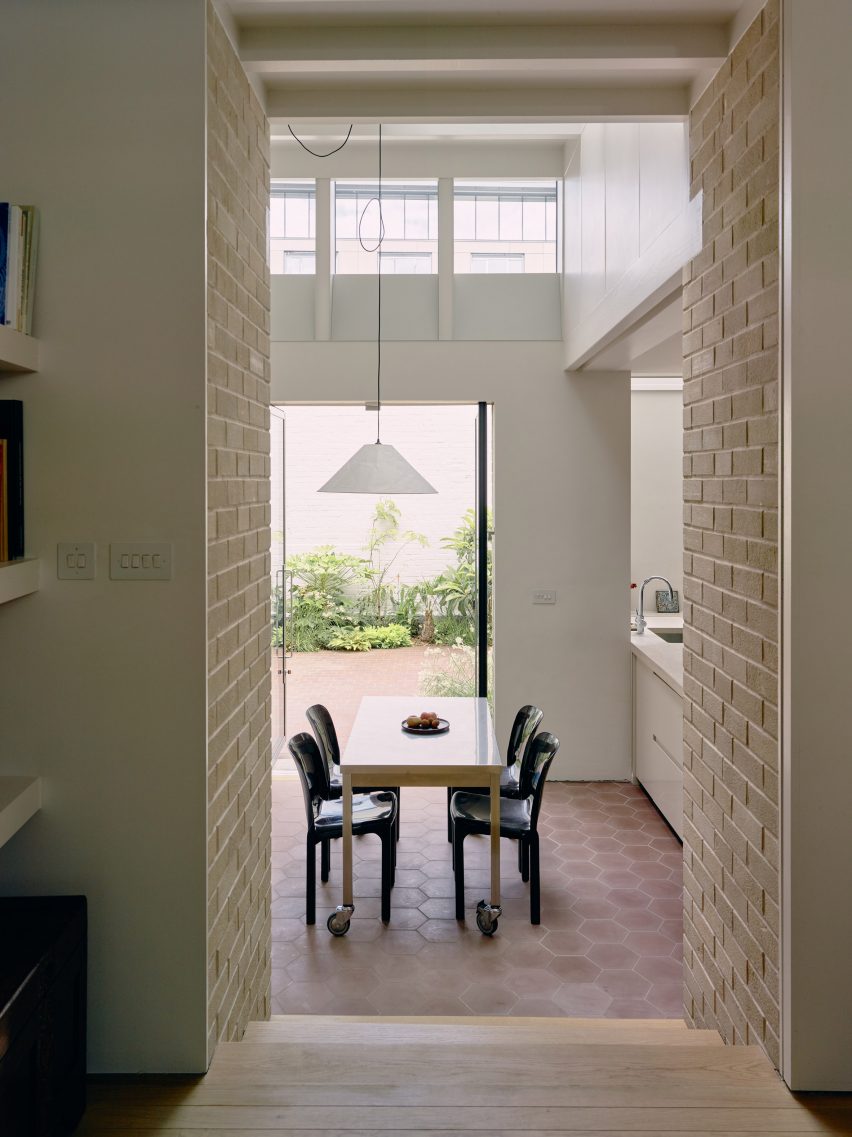 Doorway through to extension in Stone and Steel House extension by DGN Studio and Sarah Izod