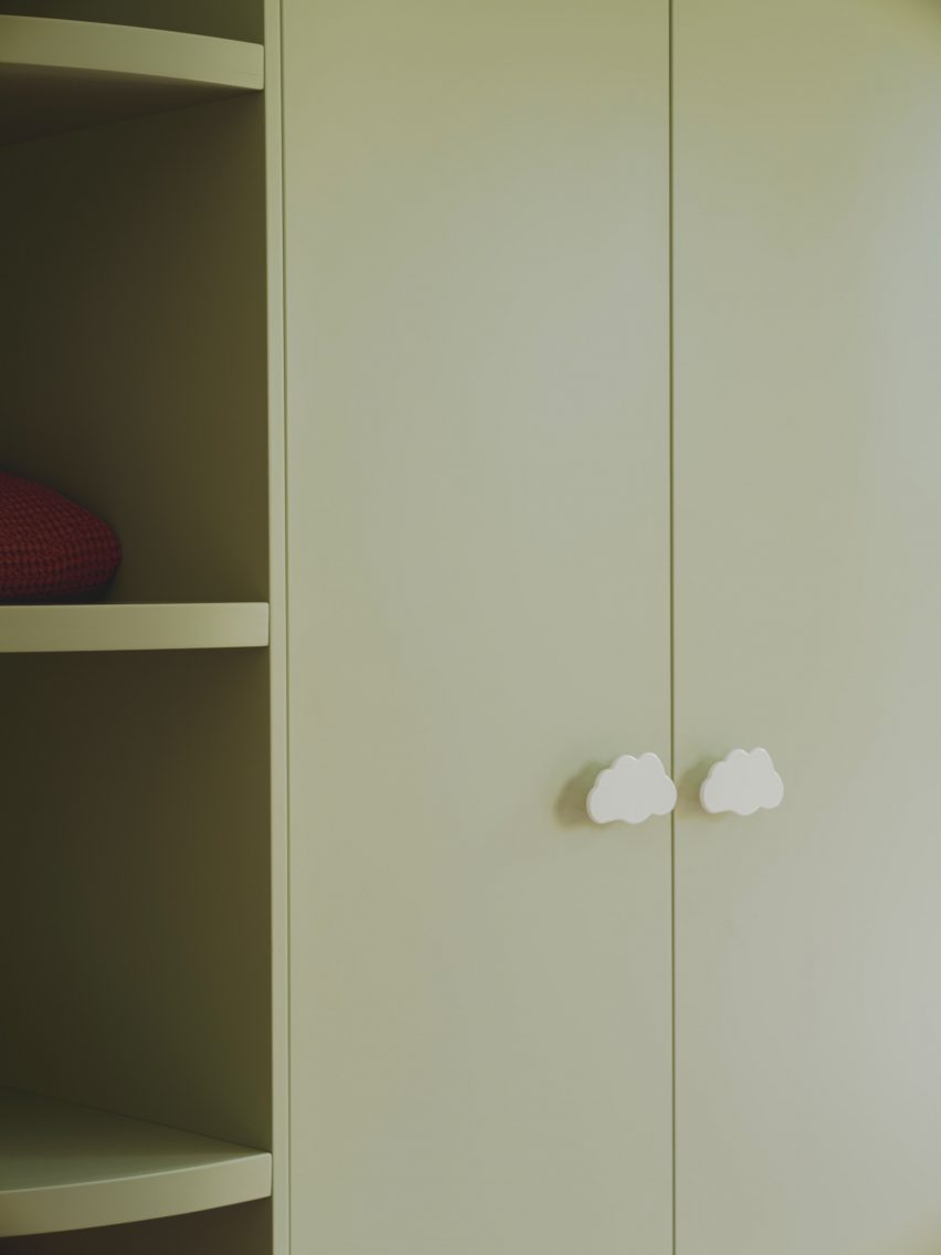 Green wardrobe with cloud-shaped handles