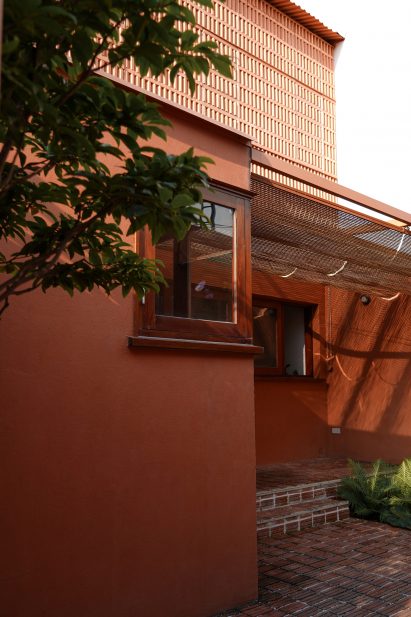 Red-toned exterior of family home