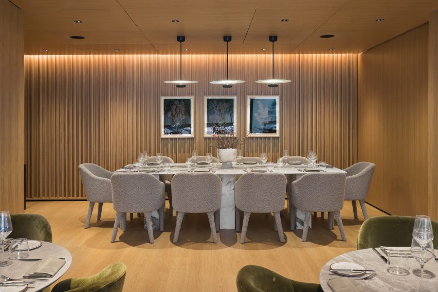 Dining space with wood walls