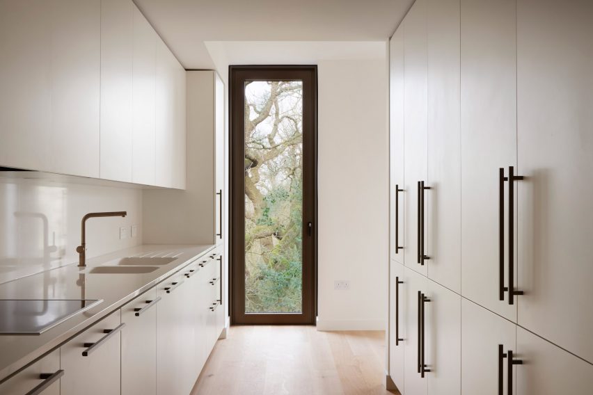 Apartment kitchen with window overlooking trees