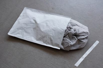 White envelope on grey surface