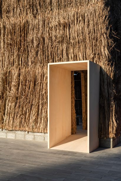 Palm frond-clad installation by Some Kind of Practice