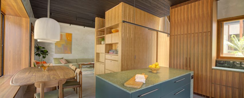 Kitchen and living space with timber finishes