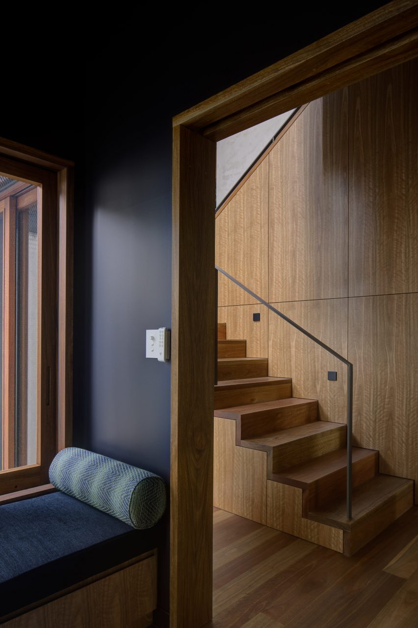 Window seat in living room and timber staircase