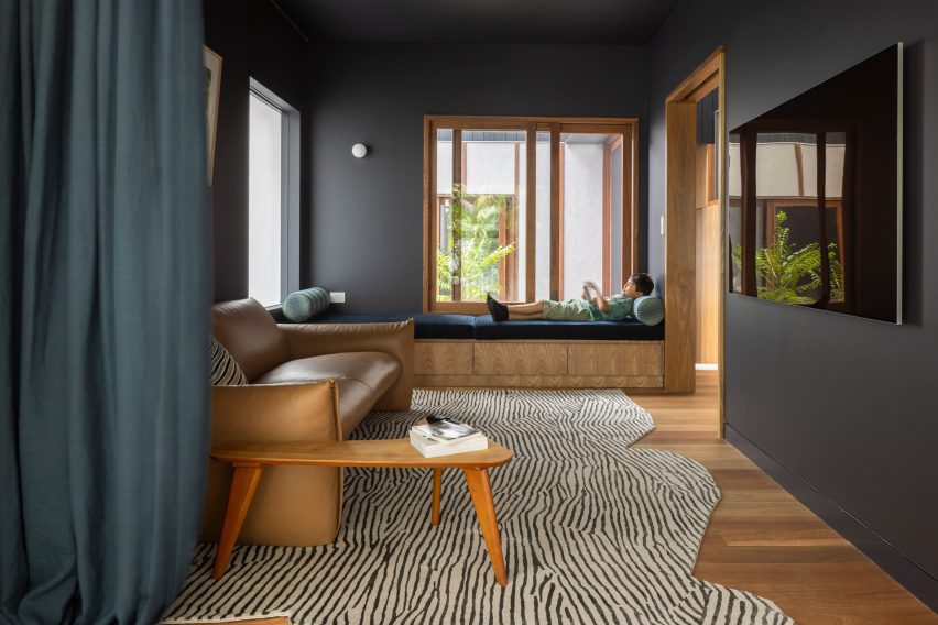 Living room with dark walls and window seat