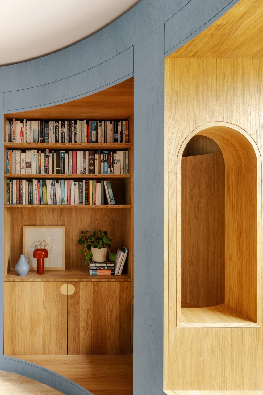 Curved timber library wall with seating nook