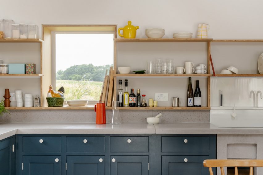 Country house kitchen with dark blue cabinets