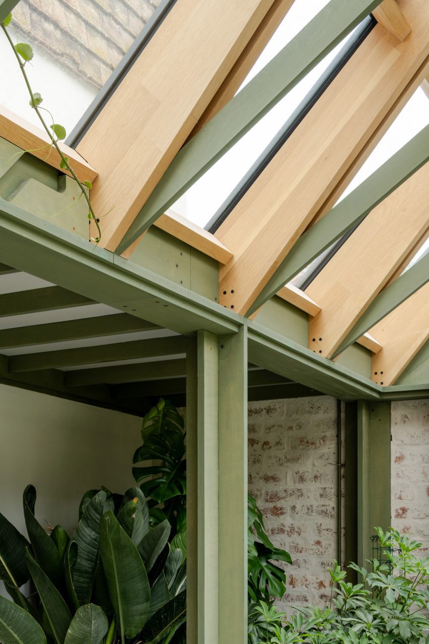 Green painted timber pitched conservatory roof