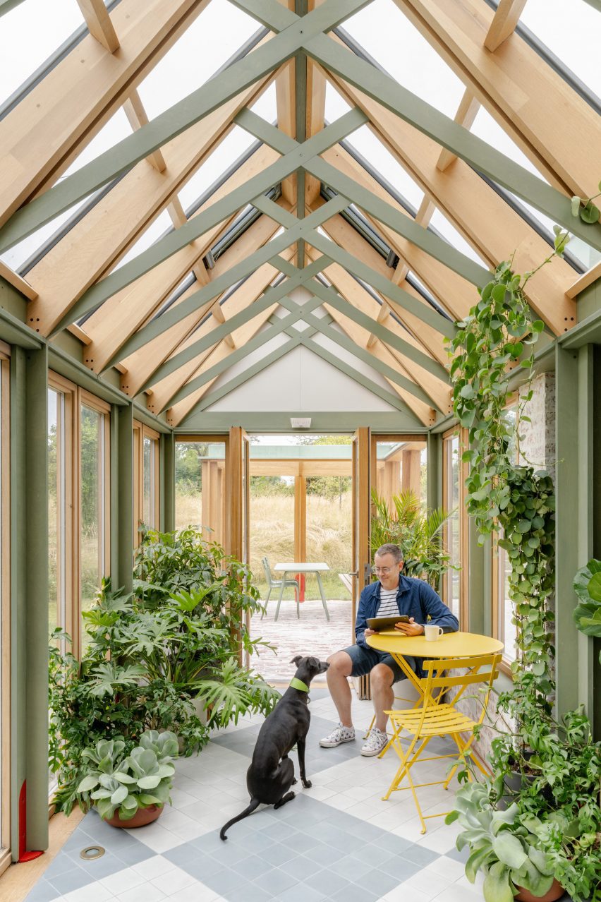 Yellow table seating area in conservatory