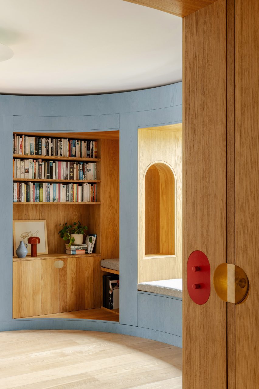 Nook seating area cut into curved timber library wall