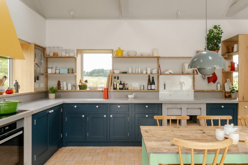 Kitchen with dark blue cabinets