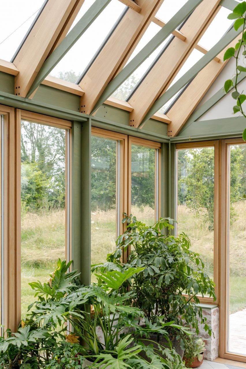 Plant-filled conservatory added to house in Kent