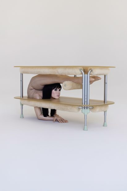 Dining table with contorted woman in the base