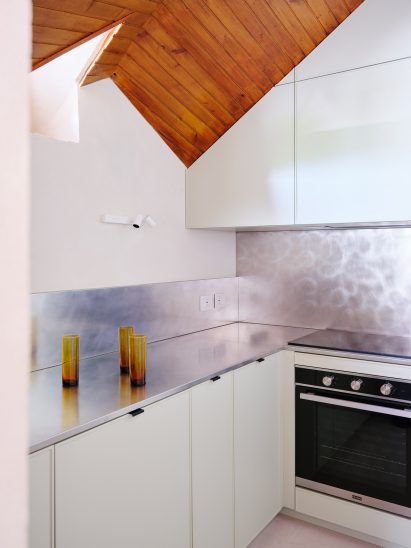 Stainless steel counter in Co.arch Studio apartment renovation in Mario Galvagni's Giomein