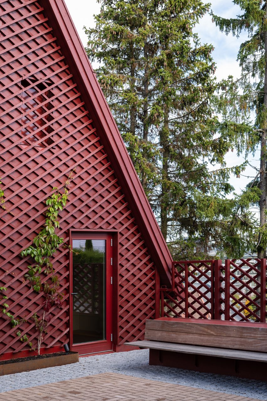 Extension with red latticework facade