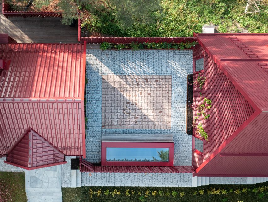 Courtyard between two red buildings