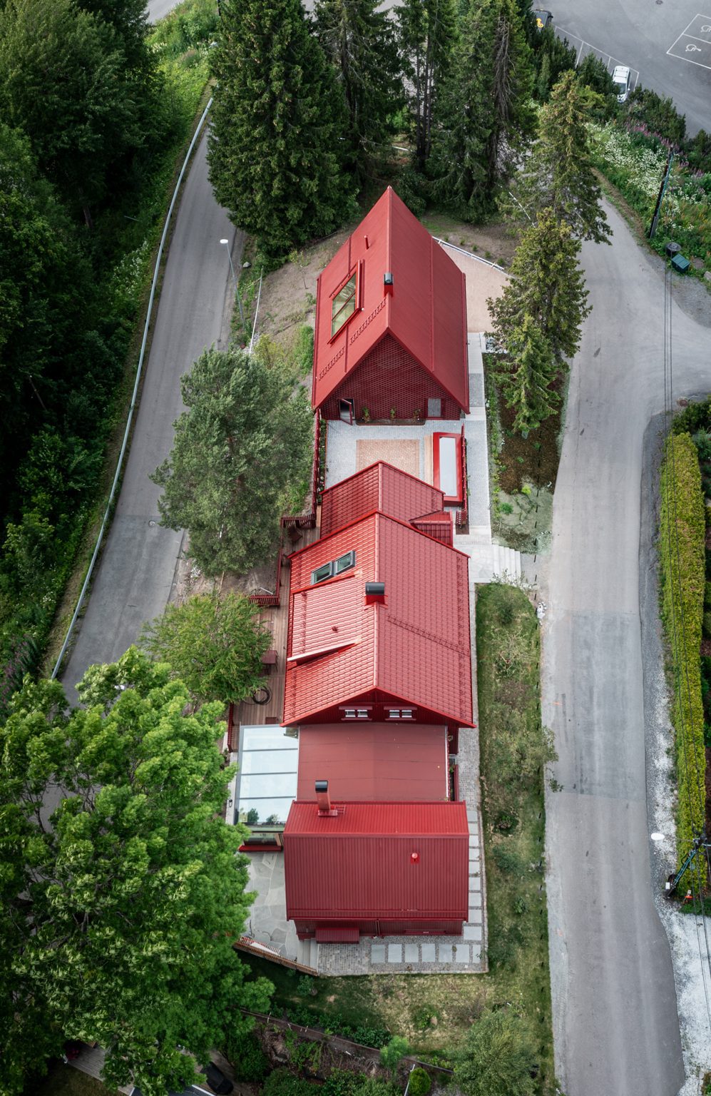 Three red pitched structures in a row