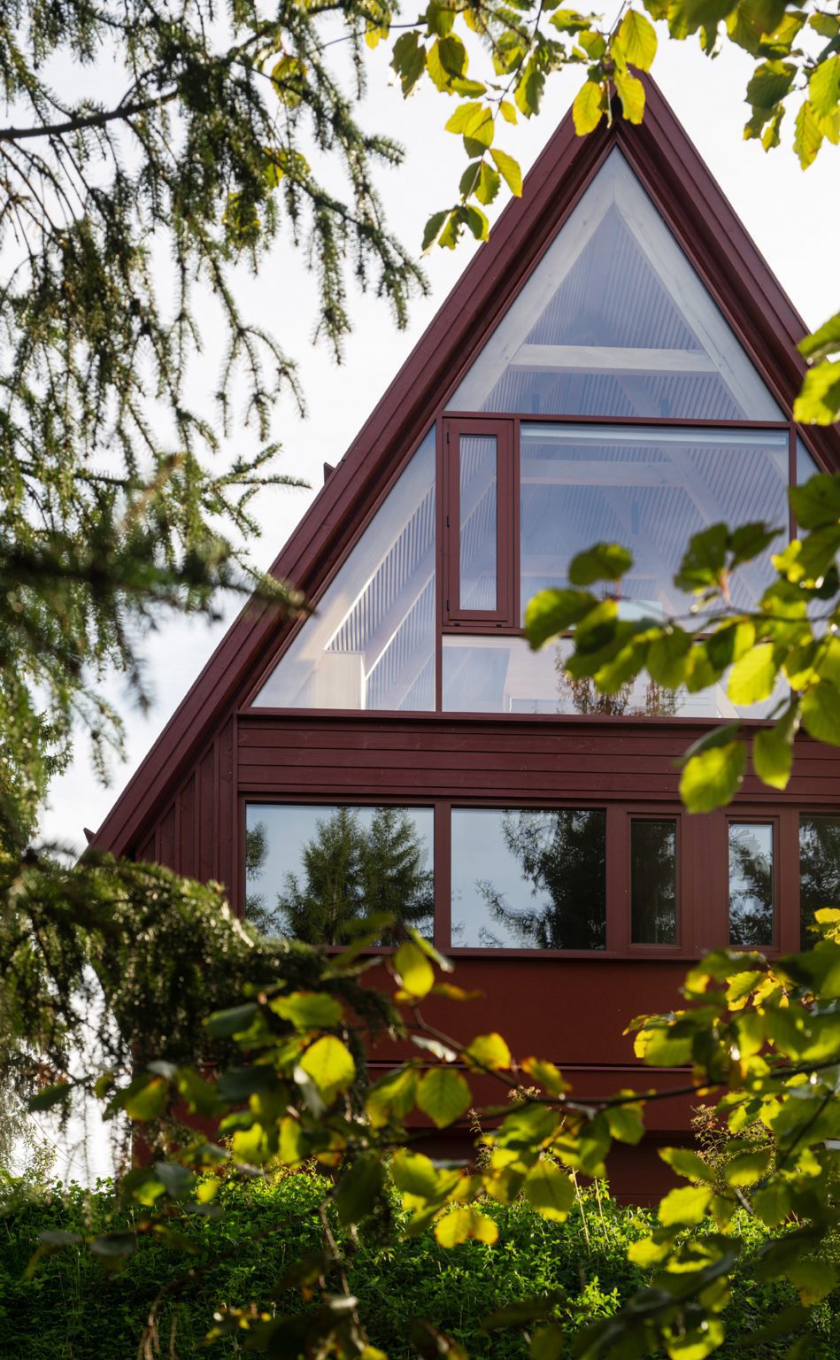 Apex window cut into red house extension