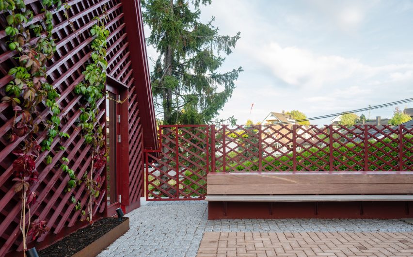 Courtyard with red house extension