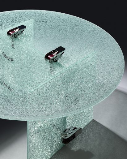 Jorge Penadés uses ratchet straps to make tables from partially shattered glass