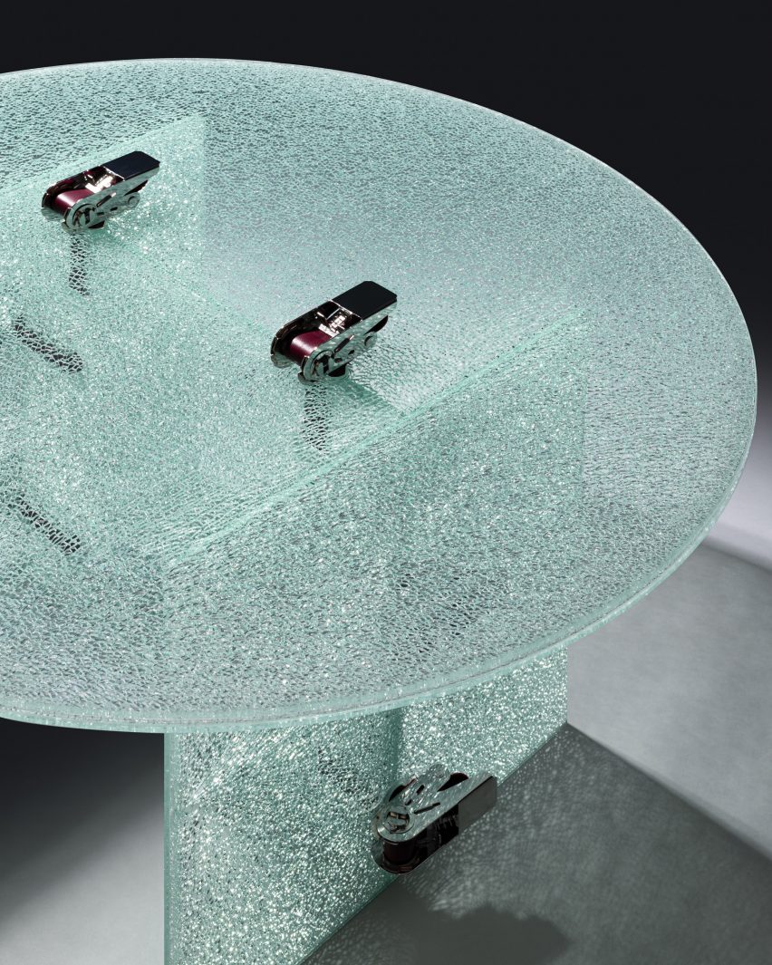 Jorge Penadés uses ratchet straps to make tables from partially shattered glass