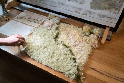 a photograph of a a fabric on a wooden surface
