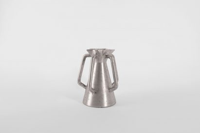 a silver jug with multiple handles