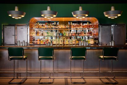 Steel bar and green walls at Motorino