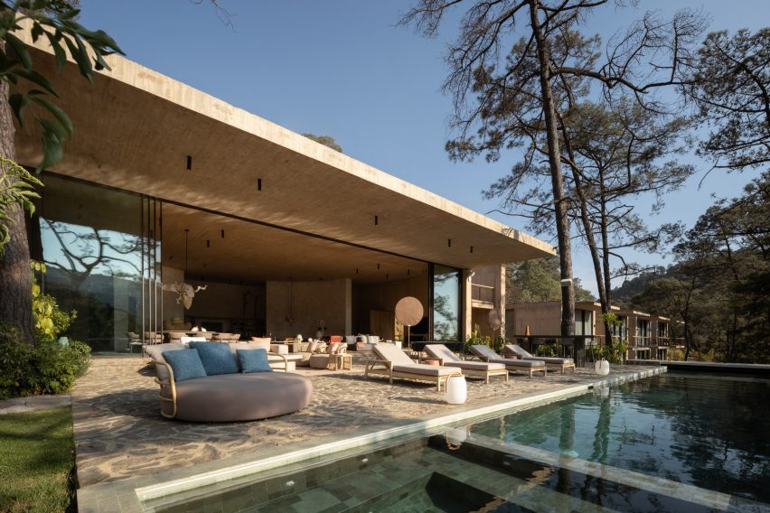 Living room and terrace at Birds-eye view of Rancho del Bosque house in Valle de Bravo by Sordo Madaleno
