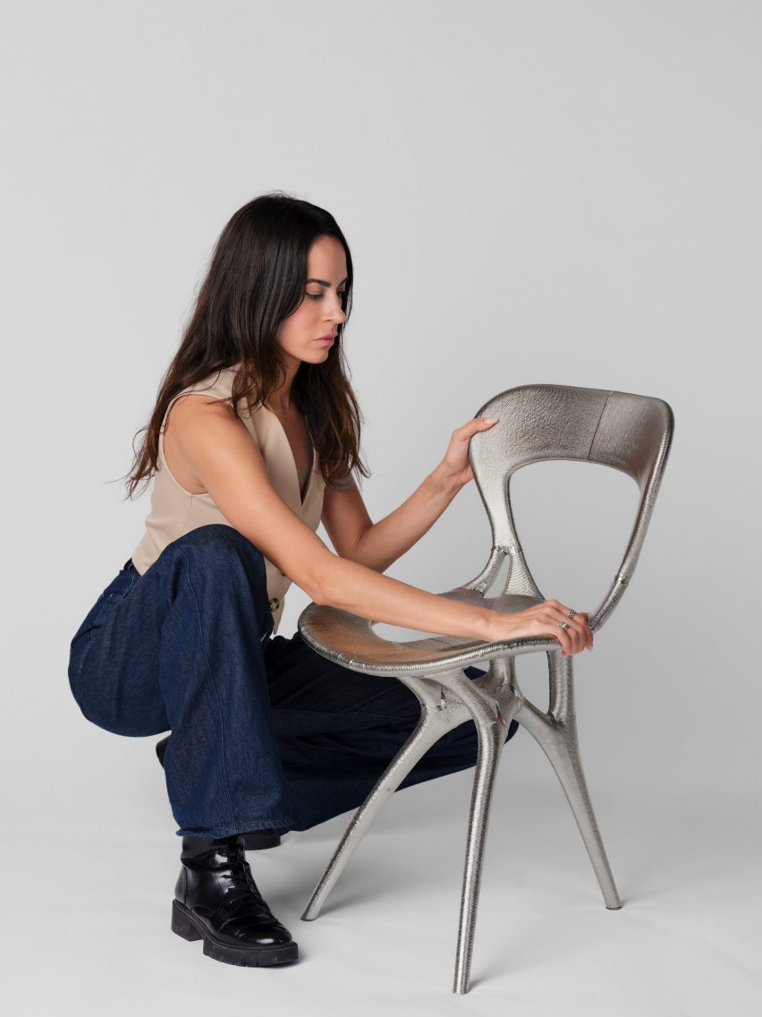 Photo of Ila Colombo with the chair produced by Ross Lovegrove studio with Google DeepMind and Modem
