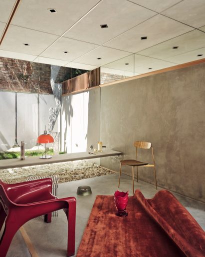 Mirrored walls and red chair