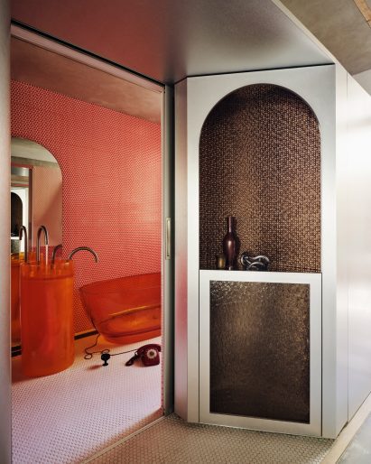 Orange kitchen with steel walls