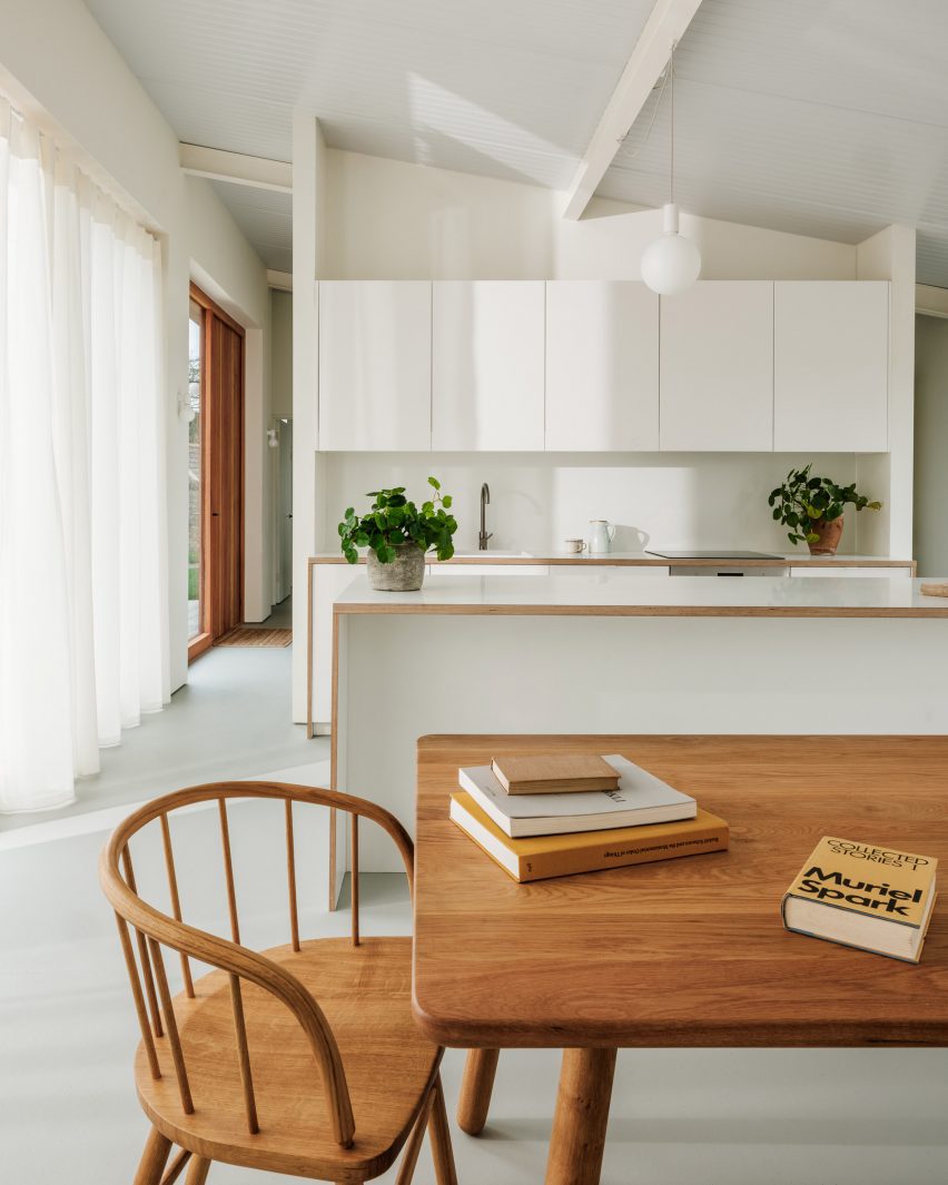 Minimal kitchen with wooden table