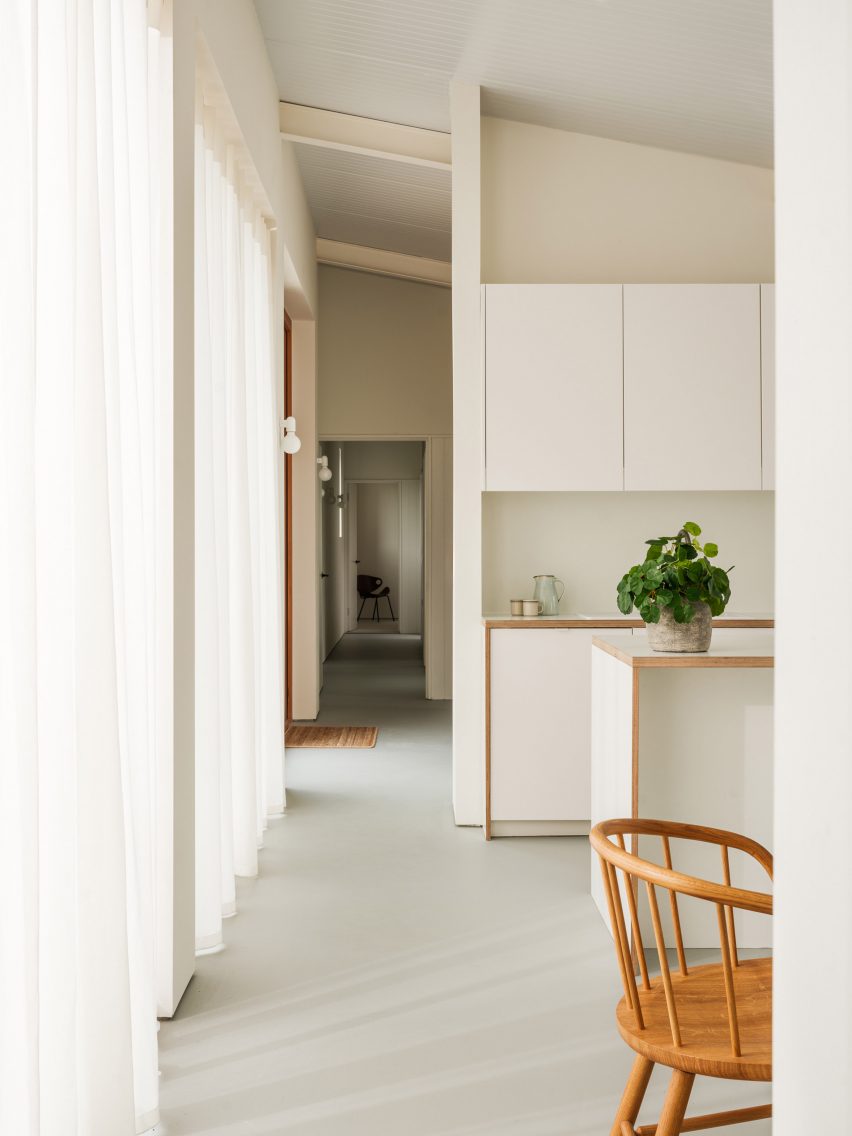 Long hallway leading away from kitchen
