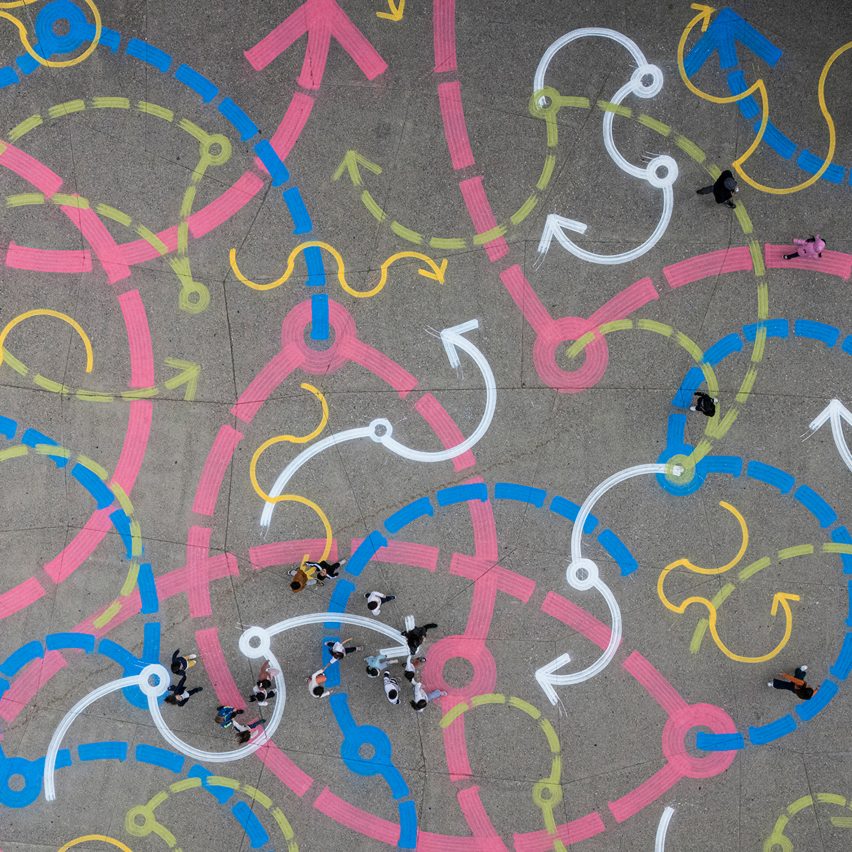 Bird's eye view of white, pink, blue and yellow street art