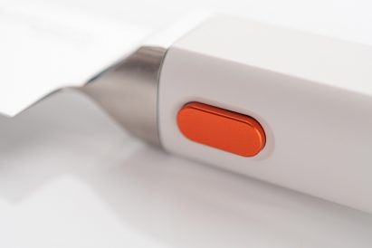 Orange button on a knife
