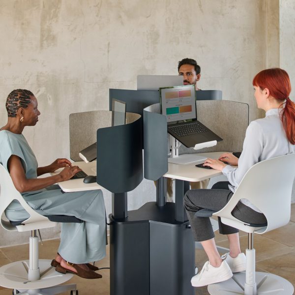 People sitting around working on the Lana laptop stand
