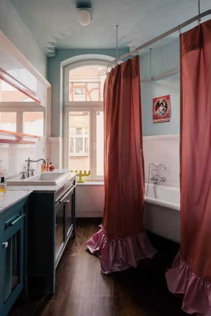 Bathroom with pink shower curtains