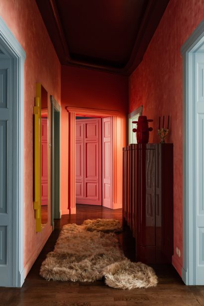 Corridor drenched in colour by COI Studio