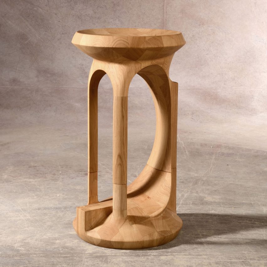 a photograph of a circular wooden stool