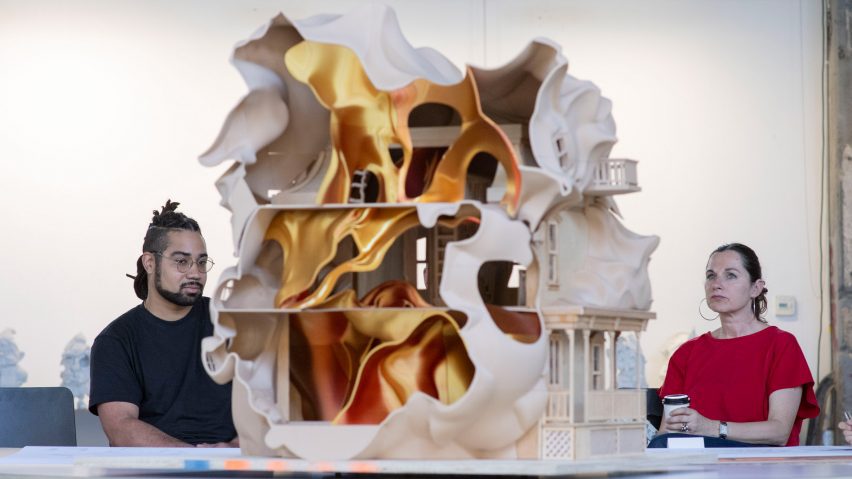 students looking at a dollshouse