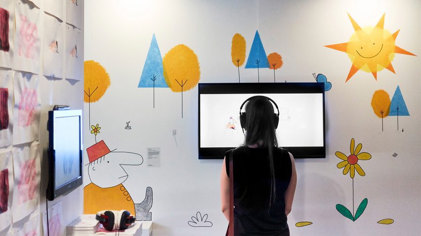 A person watching a screen in an exhibition