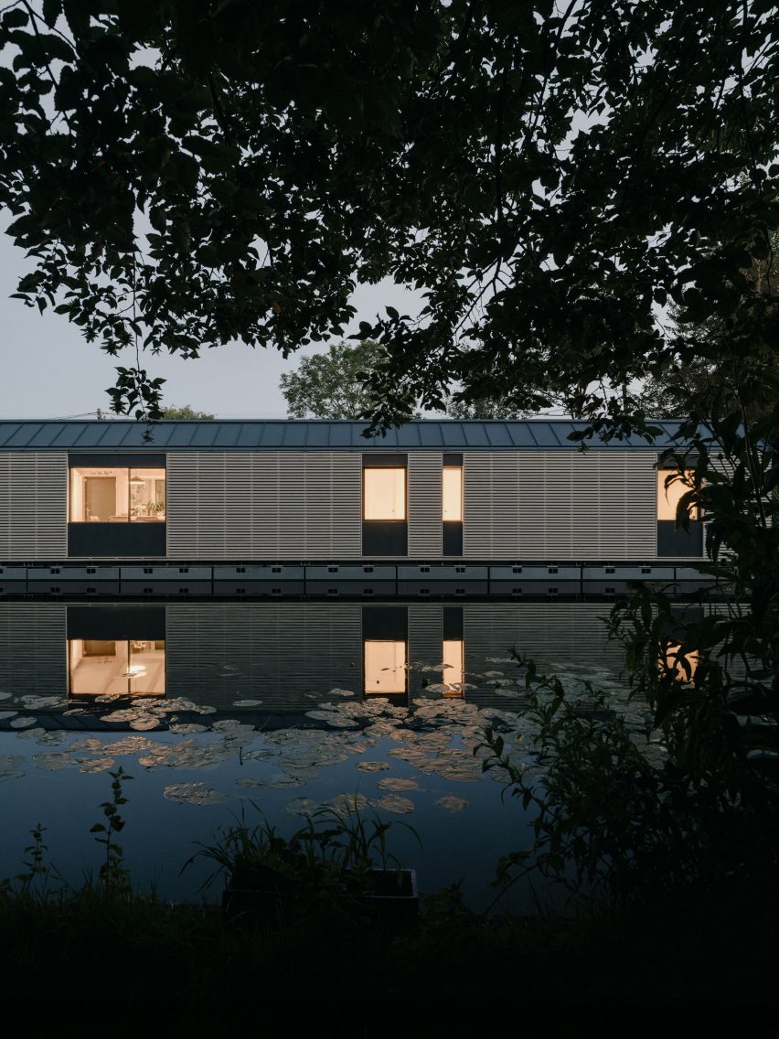 Night view of facade of Float House by TiggColl