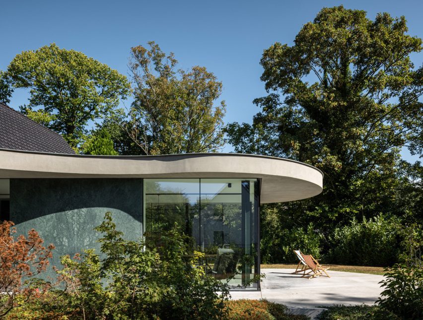 Green marble and glass extension overlooking gardens