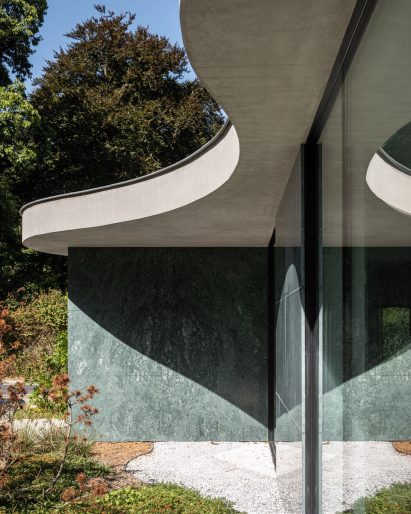 Curved concrete roof on top of The Garden Pavilion by Studio Okami